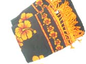 Spring fashion sarong in black and orange with hibiscus theme