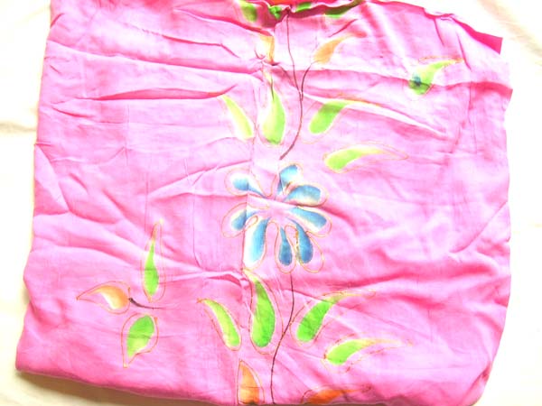Colorful flower image on pink balinese crafted sarong, garment warehouse exchange